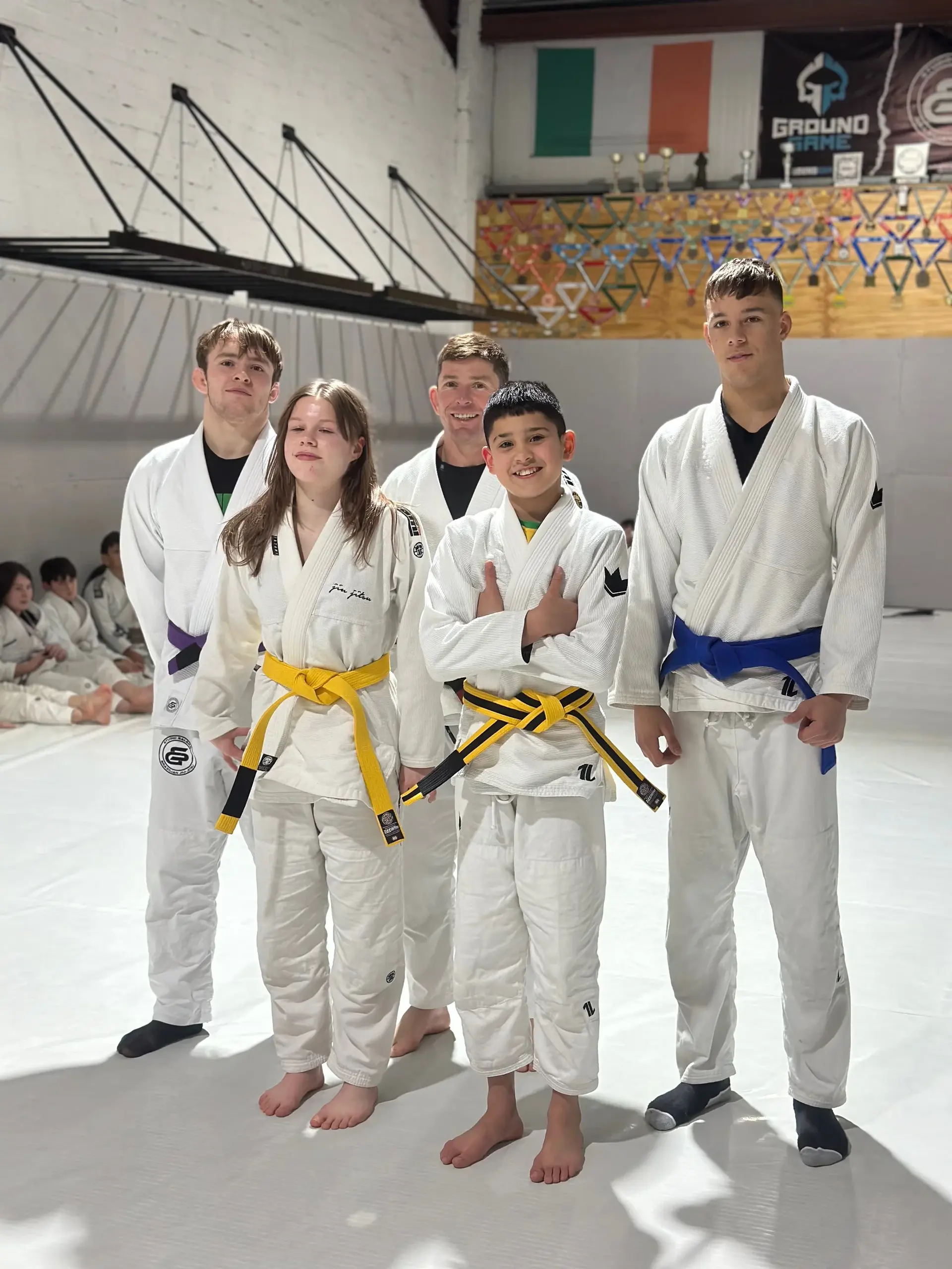 Students and instructors celebrating belt promotions at Studio Galera BJJ graduation in Bandon, West Cork 3