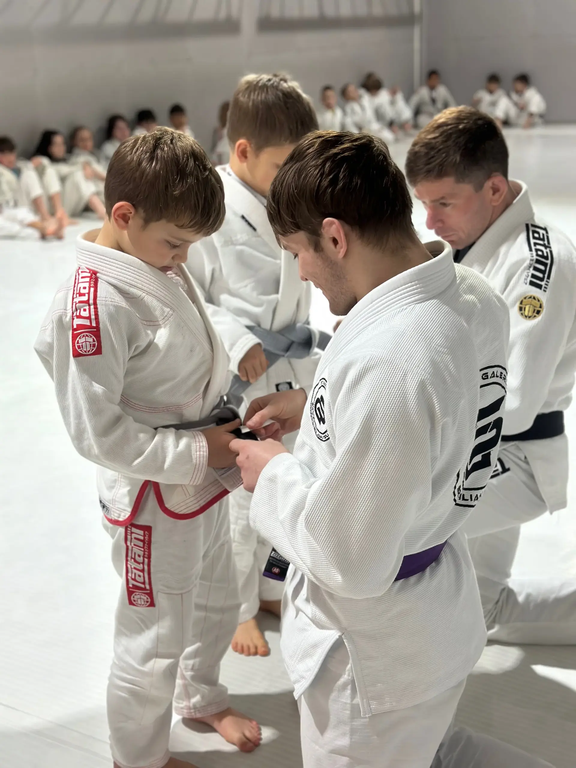 Students and instructors celebrating belt promotions at Studio Galera BJJ graduation in Bandon, West Cork 7