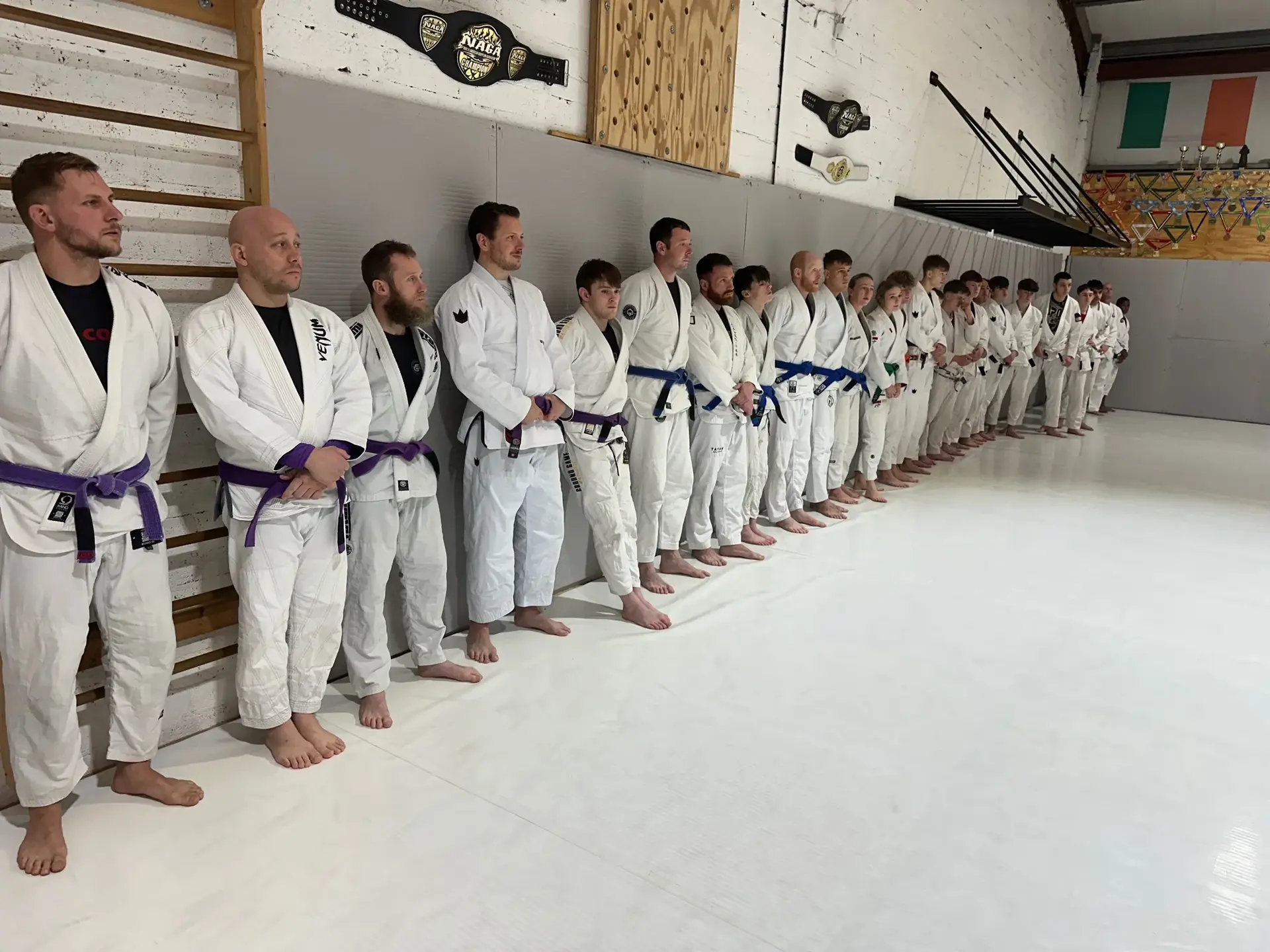 Students and instructors celebrating belt promotions at Studio Galera BJJ graduation in Bandon, West Cork 8